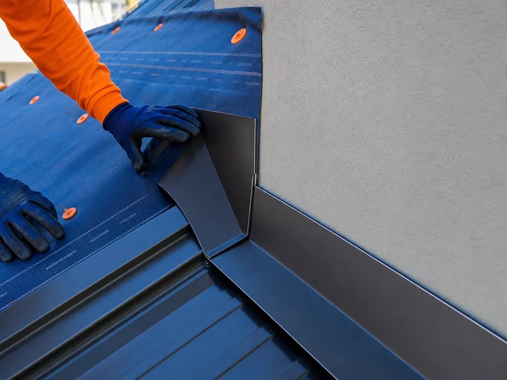 Close-up of properly installed wall flashing and underlayment with clean straight lines