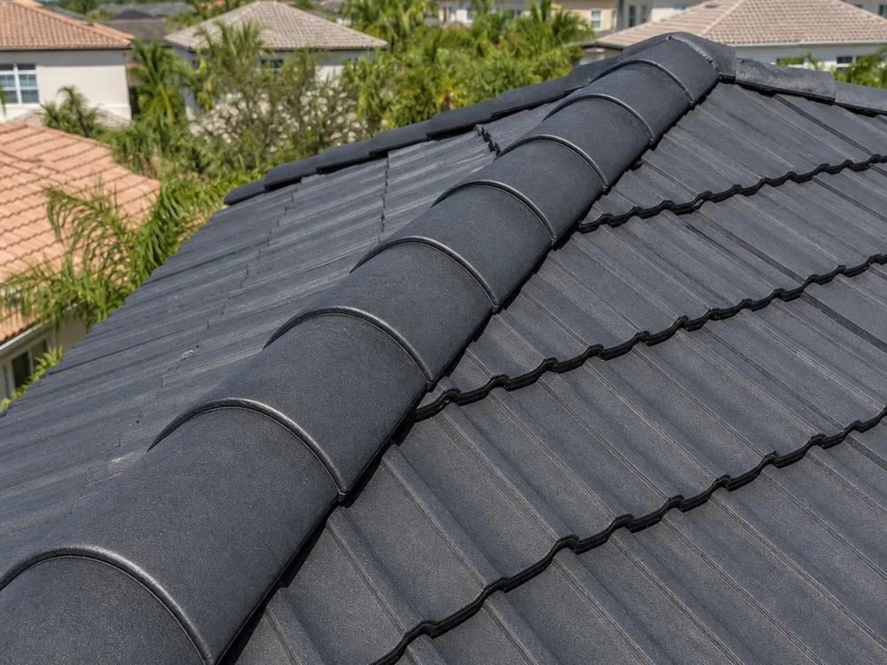 Finished tile roof hip and ridge line with clean, consistent caps and no visible gaps